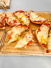 hot sandwiches with melted cheese and ketchup