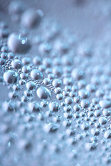 Close Up of Water Droplets Liquid Bubbles Abstract Background in Gentle Blue