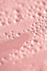 Close Up of Water Droplets Liquid Bubbles Abstract Background in Gentle Red