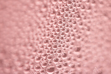 Close Up of Water Droplets Liquid Bubbles Abstract Background in Gentle Red