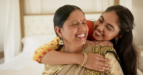 Smiling mother and daughter embracing, showing love and happiness together