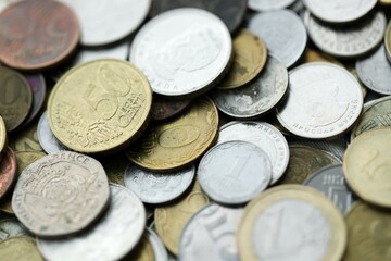 Big pile of different coins from various currencies and different countries around the world. Currency exchange