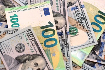 Big pile of Euro and USD banknotes. Many european and united states dollars