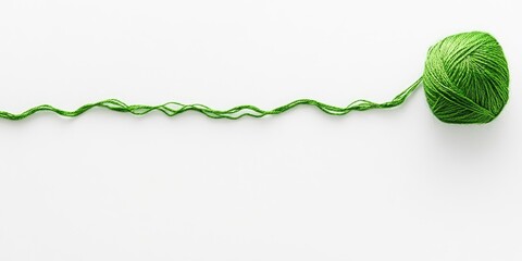 Green thread on white background with ball positioned left and wavy strand extending right, ample space for text and graphics.