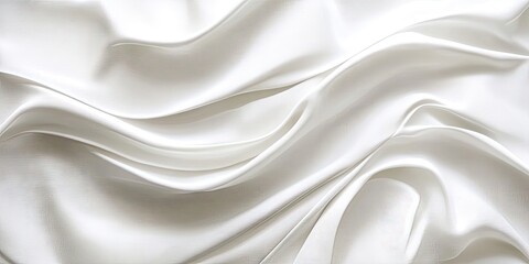 Obraz premium Elegant white satin fabric with soft waves and delicate reflections creating a soothing abstract background ideal for wallpaper or design use.