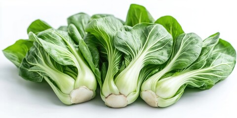 Fresh vibrant green bok choy with crisp white stems arranged side by side against a clean white background creating a clean aesthetic.