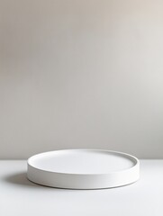 White ceramic podium pedestal with matte finish against light gray gradient background and soft lighting