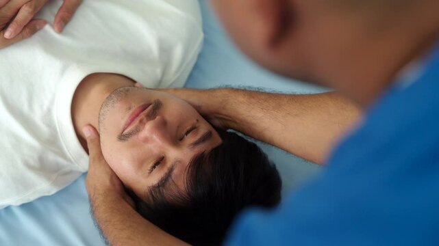 Close up face of patient recovering with physical therapist man massaging to relieve neck pain and rehabilitation physiotherapy at hospital, medical health recovery of therapy osteopathy concept.