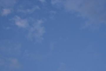 pink and grey clouds against the blue sky 