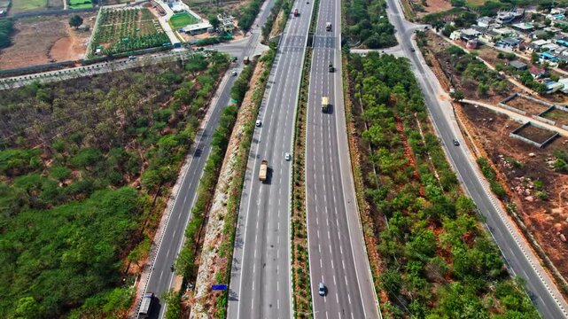 vehicles going on nehru outer ring road and services road in hyderabad, telangana. 4k, day time, drone shot.