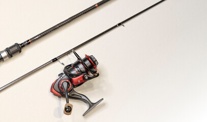 Fishing accessories, spinning, fishing rod, reel, hooks, wobblers, lures, flatlay, copyspace.