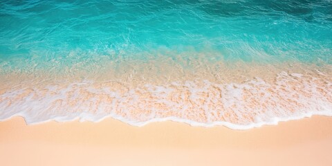 Tropical beach scene with azure water and soft beige sand creating a serene shoreline ambiance perfect for text overlay and branding.