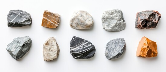 Decorative artificial stone samples arranged on a white background for interior renovation and design inspiration showcasing finishing materials