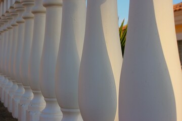 fence with white concrete railings (balusters)