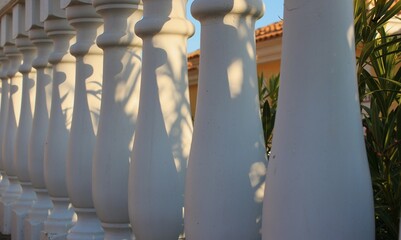 fence with white concrete railings (balusters)