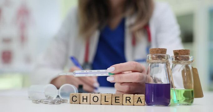 A dedicated healthcare professional is studying cholera using sophisticated lab equipment and various vials