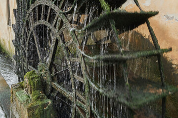 Close-up shot of an antique water wheel at a watermill in Portogruaro a city in Italy