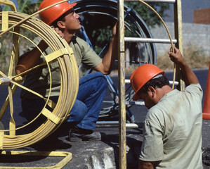 Fiber optic cable outdoors men worker