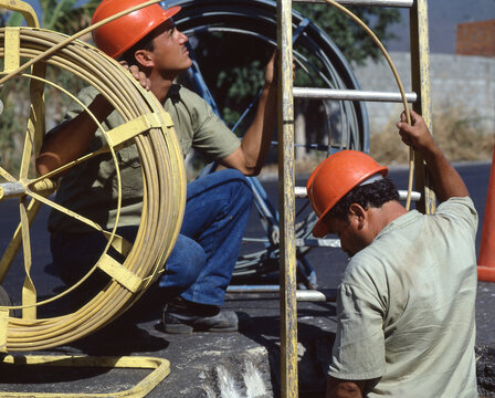 Fiber optic cable outdoors men worker