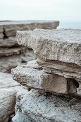 Layered rock formations with a muted sky background.