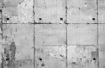 This image shows a black and white photograph depicting a concrete wall