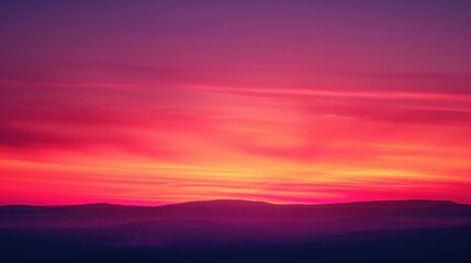 Obraz premium Breathtaking Sunset Over Mountains with Vibrant Colors and Soft Clouds Creating a Serene and Tranquil Atmosphere in Nature's Palette of Warm Hues