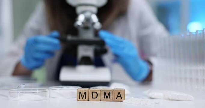 A thorough and detailed examination of MDMA is conducted using advanced microscope and specialized laboratory equipment