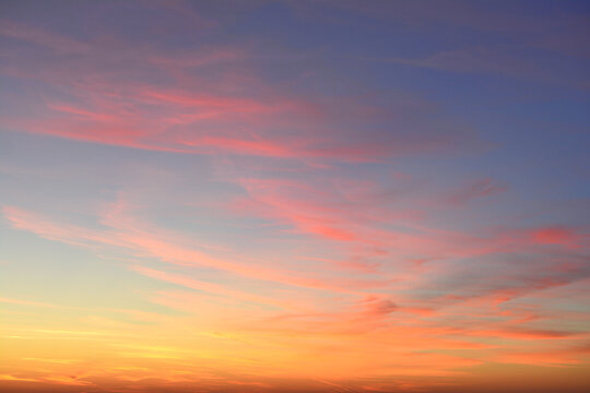 a background of the sunset sky with some clouds and light - Powered by Adobe