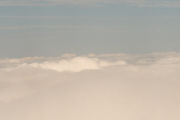 Aerial photograph of clouds outside of my airplane window on a cross country plane trip from Richmond Virginia to New York City