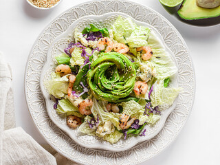 salad with shrimp, cheese and avocado in the form of a rose