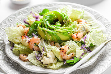 salad with shrimp, cheese and avocado in the form of a rose