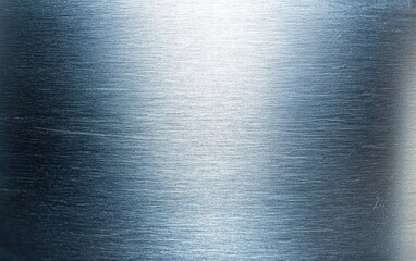 A detailed close-up of a metallic plate showcasing intricate reflections and surface textures, emphasizing its shiny and polished characteristics.