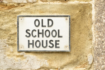 House name sign "Old School House", on wall in Durgan village, Cornwall, England