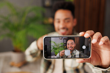 Young man he wear grey casual clothes doing selfie shot on mobile cell phone post photo on social...