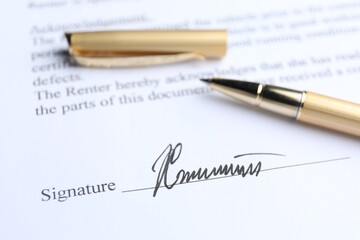 Ballpoint pen and signature on contract, closeup