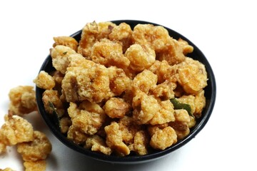 A small portion of fried corn nuts isolated on a white background.