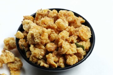 A small portion of fried corn nuts isolated on a white background.