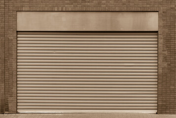Closed steel shutter door of warehouse, storage or storefront for metal door background and textured.