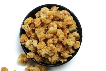 A small portion of fried corn nuts isolated on a white background.