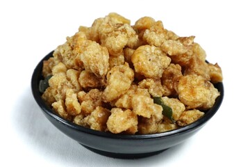 A small portion of fried corn nuts isolated on a white background.