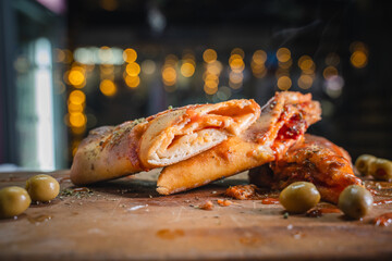 Mouthwatering cal zone cross-section with melted cheese oozing