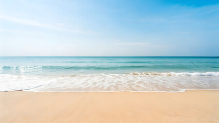 Obraz premium The vast ocean meets the sandy beach under a vibrant blue sky, creating a picturesque tropical seascape perfect for summer vacations