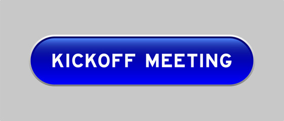 Blue color capsule shape button with word kickoff meeting on gray background