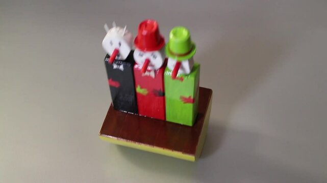 three funny clowns, wooden puppets roly poly