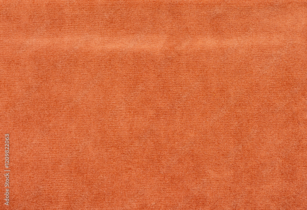 Poster the orange fabric has a rough texture and is folded in half