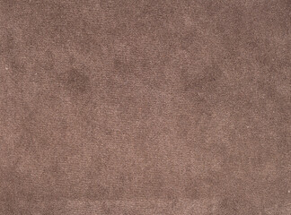A close up of a brown fabric with a fuzzy texture
