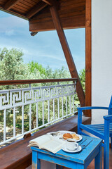 Blue hotel room interior concept, white bed and bathroom style.