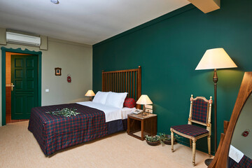 Green hotel room concept interior style, old furniture retro decoration.