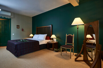 Green hotel room concept interior style, old furniture retro decoration.