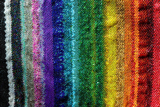 Rainbow background. Multi-colored beads. Beaded background.